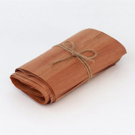 Thin cedar wrapping sheets tied with twine